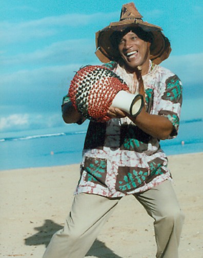 Babasango Playing Musical Instrument on Beach