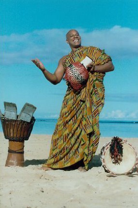 Babasango Playing Instrument on Beach