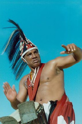 Babasango Playing Instrument and Dancing on Beach